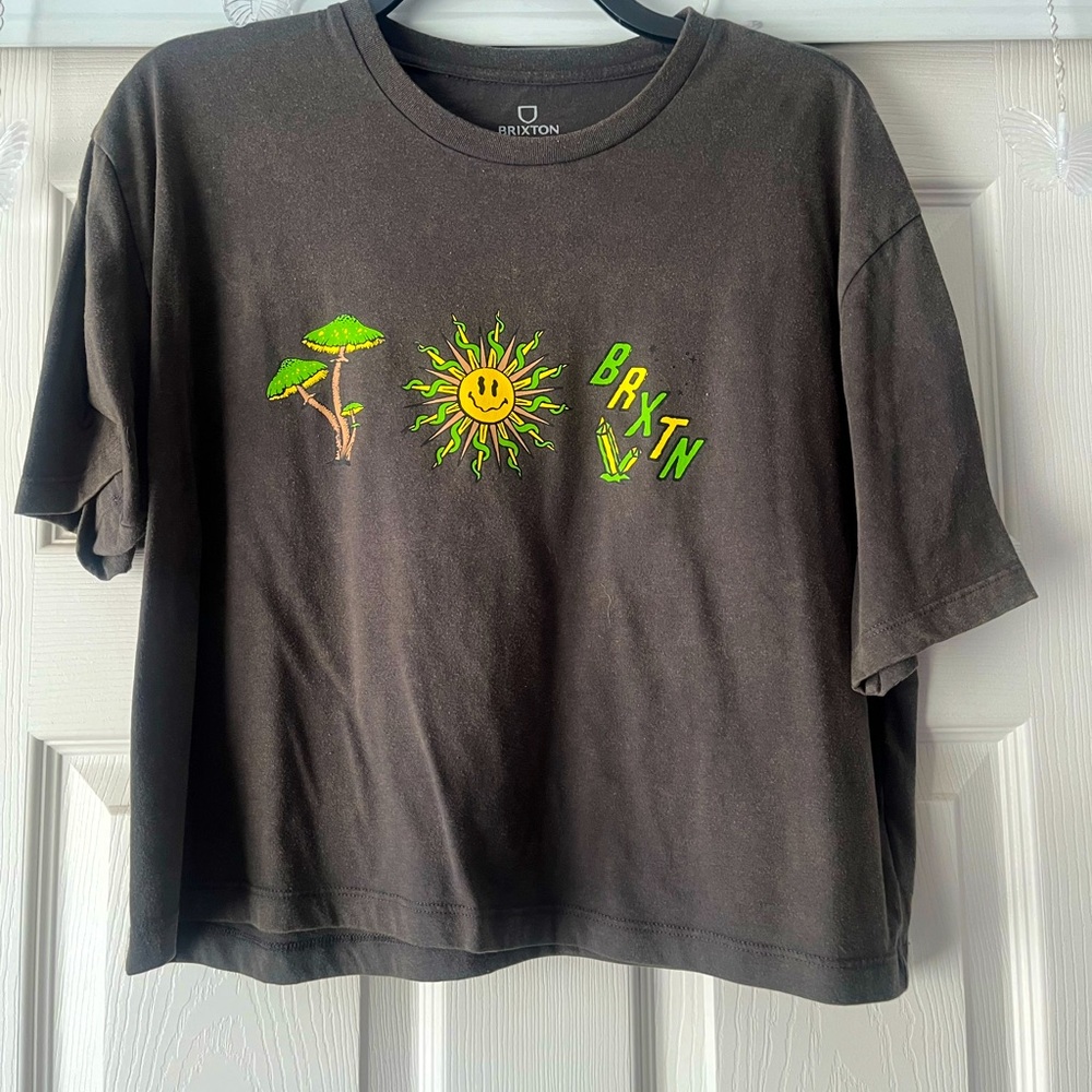 Grey with design tee and slightly cropped but is loose.